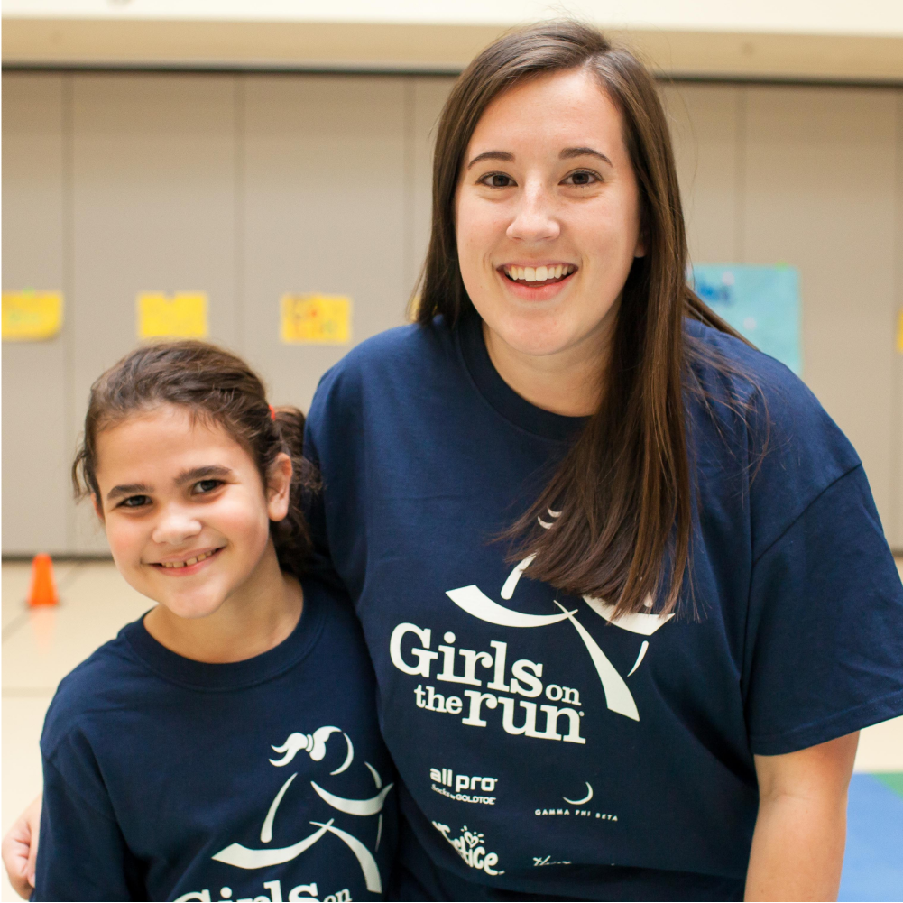 Smiling Girls on the Run coach and participant